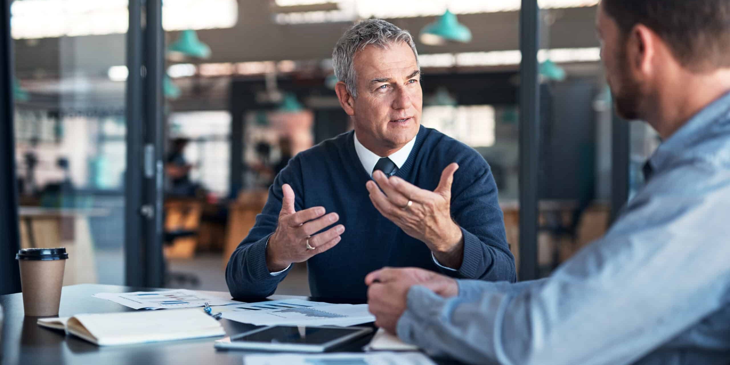 Businessmen-talking-scaled-1.jpg