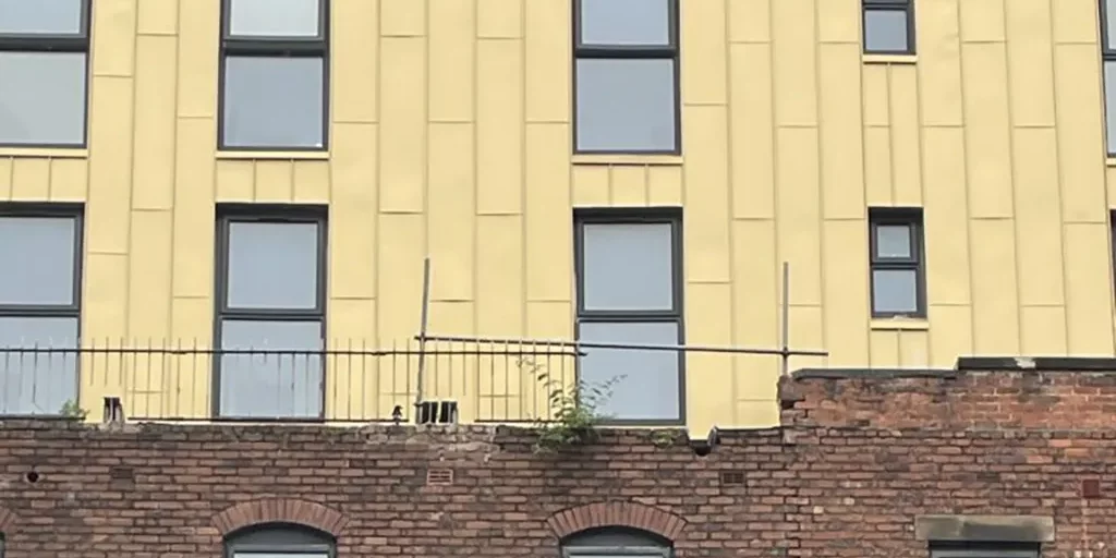 HSE-Rear-of-35-Glovers-Court-Preston-showing-exposed-RSJs-cracks-and-missing-coping-768×1024-1.webp.webp