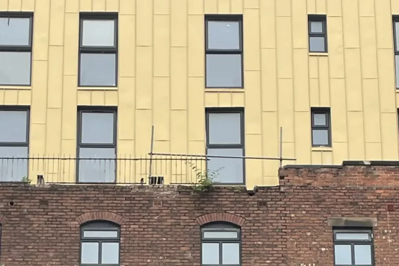 HSE-Rear-of-35-Glovers-Court-Preston-showing-exposed-RSJs-cracks-and-missing-coping-768×1024-1.webp.webp